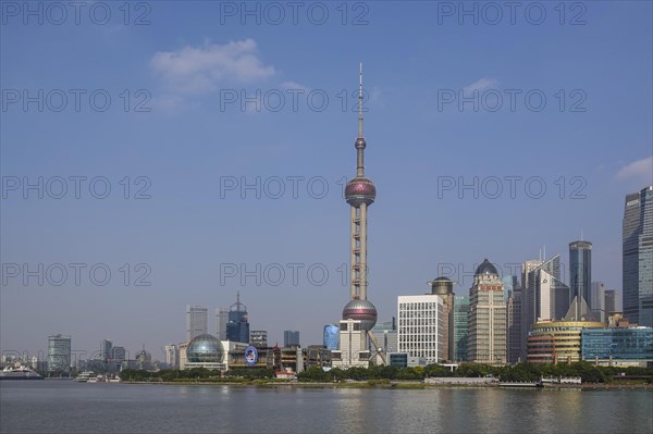 View over the Huangpu River to the skyline of the special economic zone Pudong with Oriental Pearl Tower