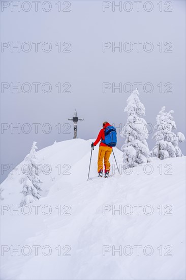 Young woman on ski tour