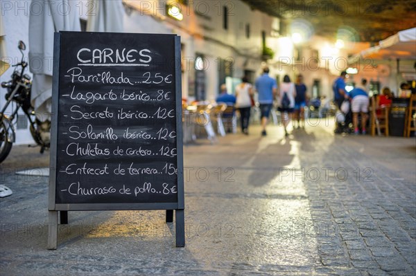 Menu of the meats of restaurant in the sidewalk of Setenil de las Bodegas