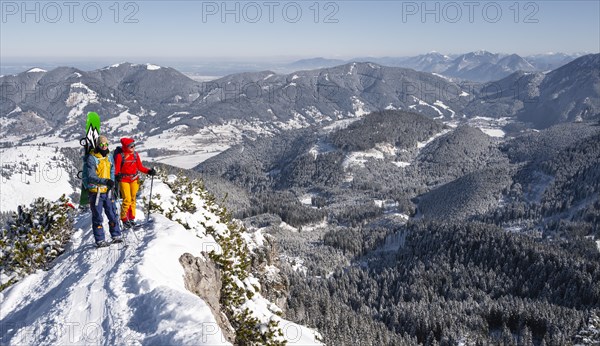 Young woman and man on ski tour