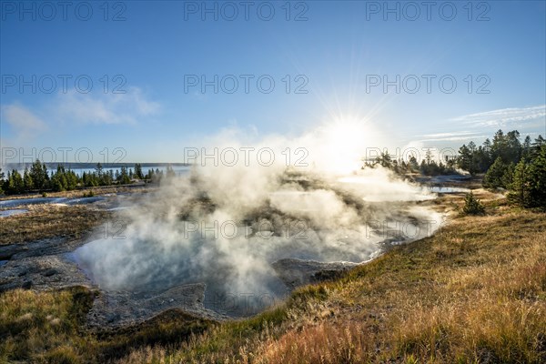 View of steaming hot springs in the morning sun