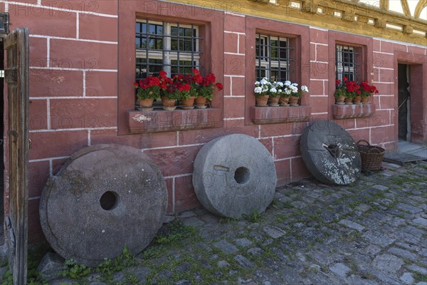 Old millstones in front of the flour mill