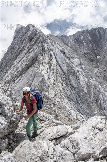 Young female hiker with helmet