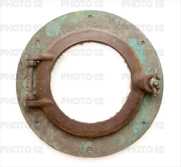 Aged antique ship porthole isolated on a white background with clipping path -inner and outer