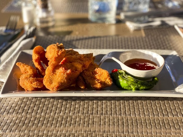 Fried chicken wings with sweet and sour sauce