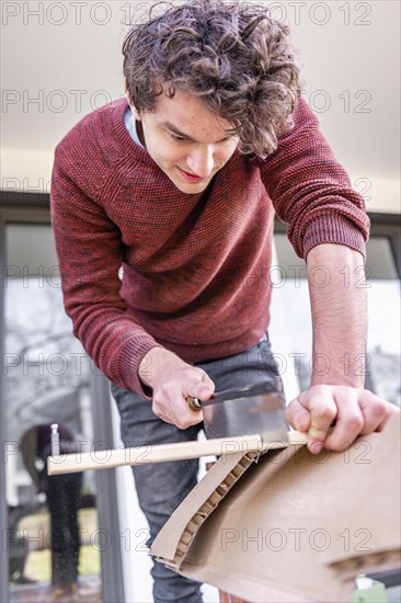 Young man doing DIY in his apartment