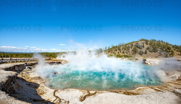 Hot spring with steaming turquoise water