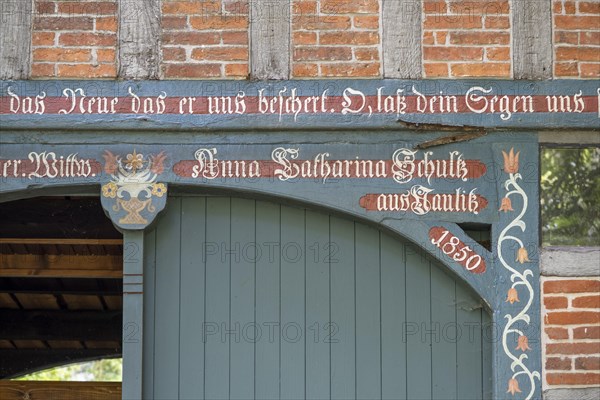 Half-timbered house in the round village of Satemin