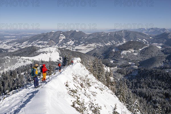 Young woman and man on ski tour