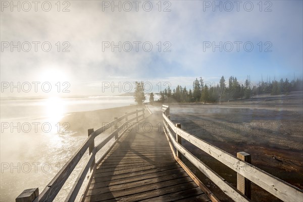 Boardwalk between steaming hot springs