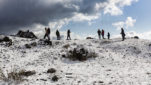 Tourists in snowy landscape