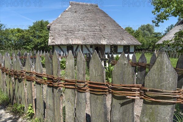Wooden fence connected with willow rods