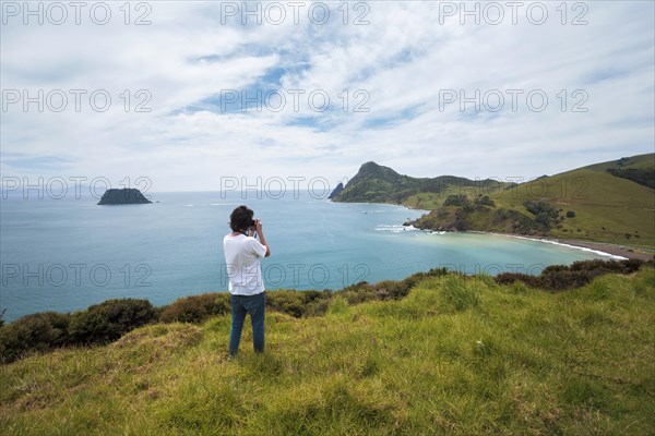 Guy with camera at Fletcher Bay