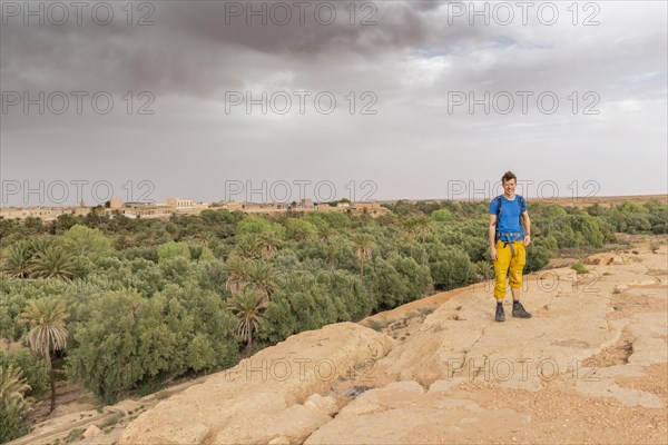 Young man at a cliff edge