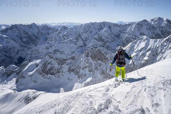 Ski tourers on the descent from the Alpspitz east slope