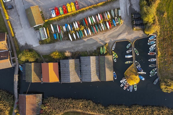 Boats and boathouses in the harbour from above