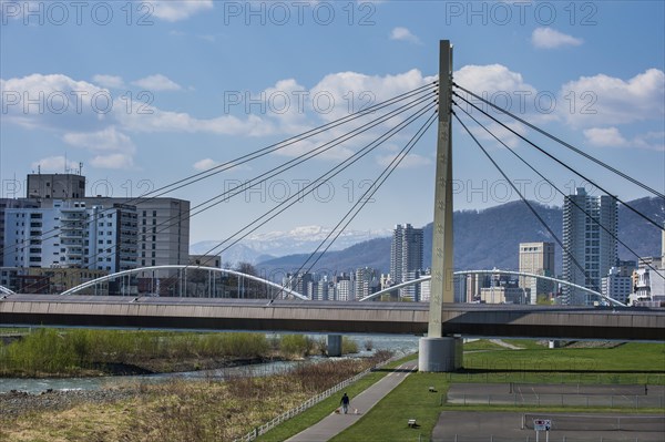 Massive bridge spanning across the Ishikari river flowing through Sapporo