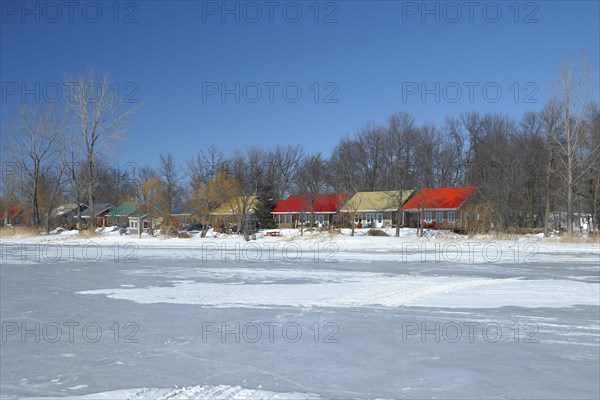 Colourful cottages along the frozen Saint Lawrence River