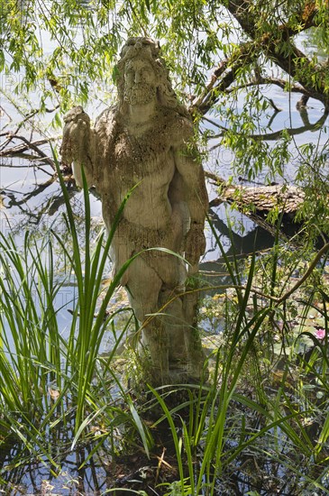 Sculpture of Hercules by Erwin Franz Wiegerling with weeping willow