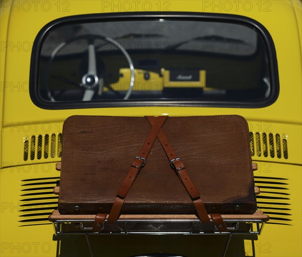 Suitcase on bonnet of a Fiat Nuova 500 Cinquecento