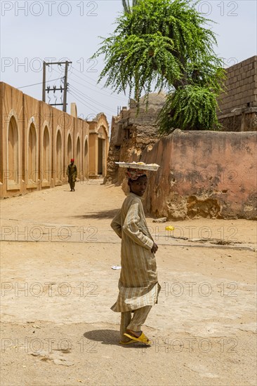 Young boy with a plate on his head