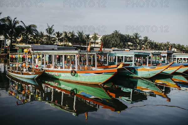 Colorful tourist boats on the river in Hoi An