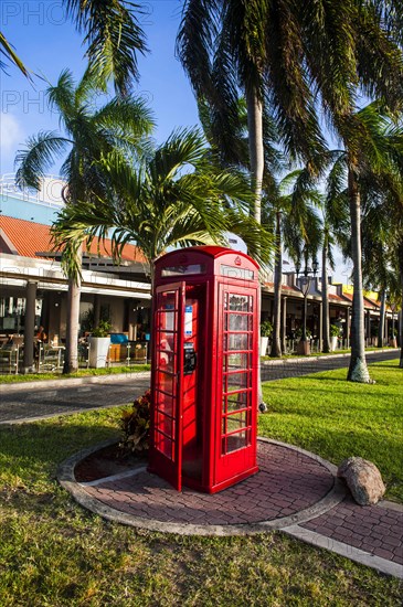 Red telephone box in downtown Oranjestad