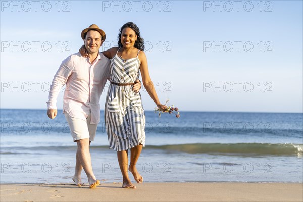 Young couple enjoying time together on the beach in Algarve