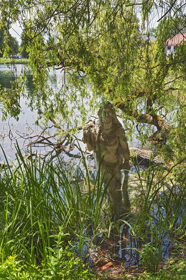 Sculpture of Hercules by Erwin Franz Wiegerling with weeping willow