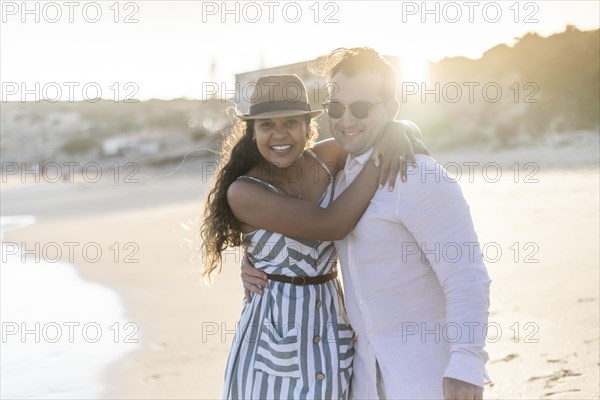 Young couple enjoying time together on the beach in Algarve