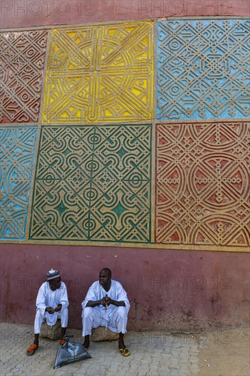 Men sitting at the entrance to Gidan Rumfa