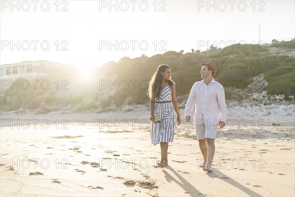 Young couple enjoying time together on the beach in Algarve