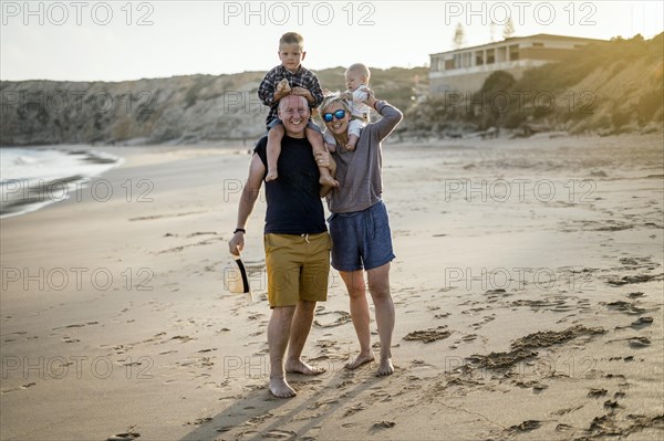 The family with two small boys enjoying the beach