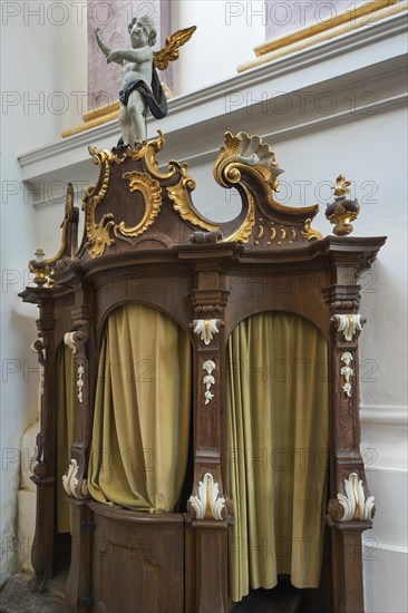 Confessional with carvings