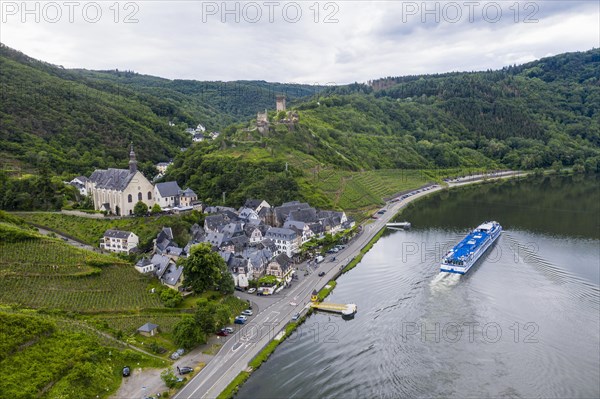 Cruise ship passing Beilstein on the Moselle with Metternich castle