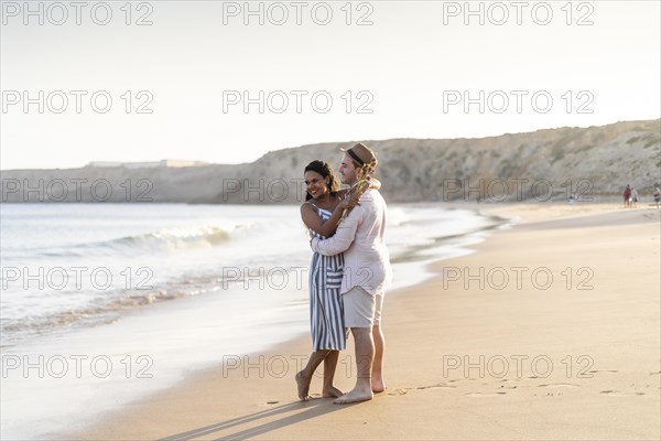 Young couple enjoying time together on the beach in Algarve