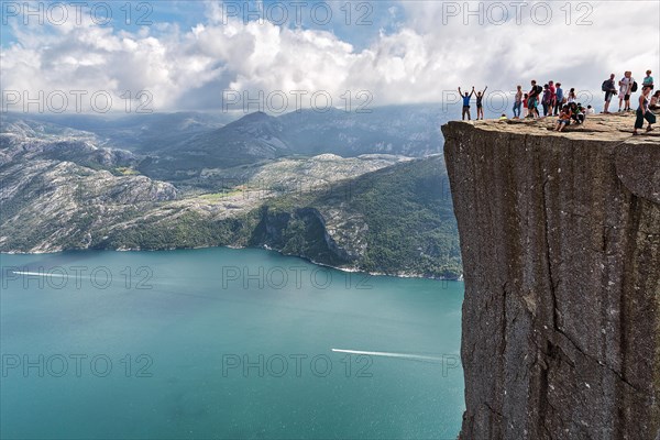 Hiker on rocky peak Preikestolen