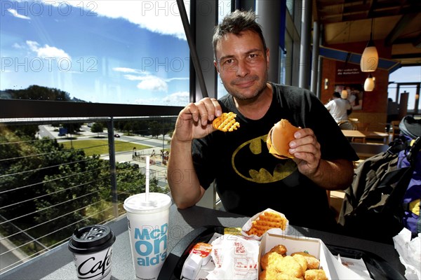 Man eats hamburger