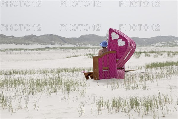 Beach chair with two hearts at the beach