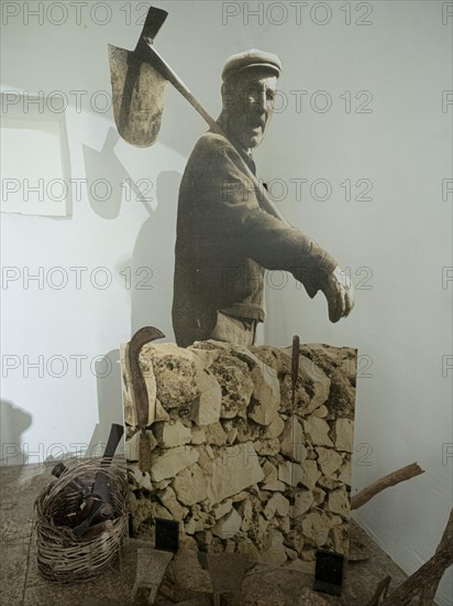 Worker with stones for trulli houses