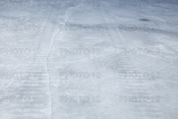 Frozen snowmobile prints