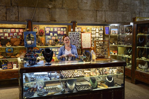 Merchants in illuminated catacombs