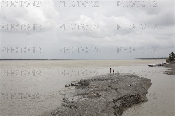 Two children on a sinking dike