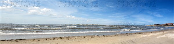 Panoramic view of the sandy beach at the harbour of the island Baltrum