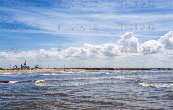 Sandy beach beach at the pier of the ferry line Nessmersiel-Baltrum