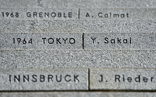 Stairs to the Olympic Museum with the venues of the Olympic Games and the names of the last torchbearer