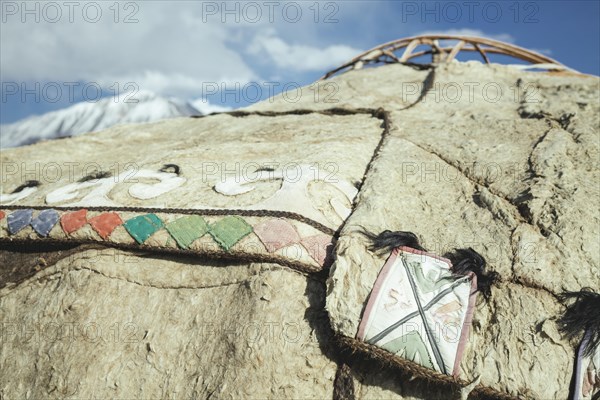 Talismans made of leather and coloured fabric on a Kyrgyz yurt