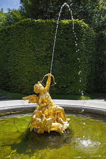 Fountain figure love god Cupid with bow and arrow