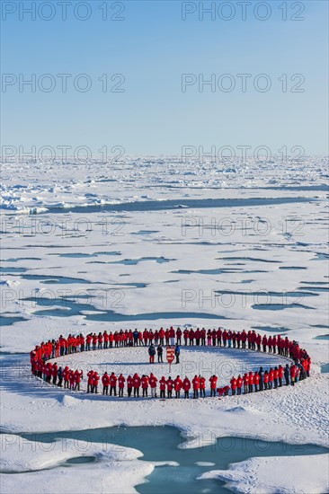 People forming a circle to memorise to have arrive on the North Pole