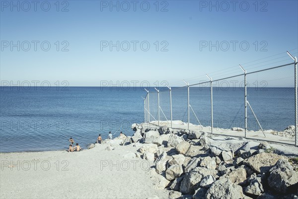 Beach with border fence